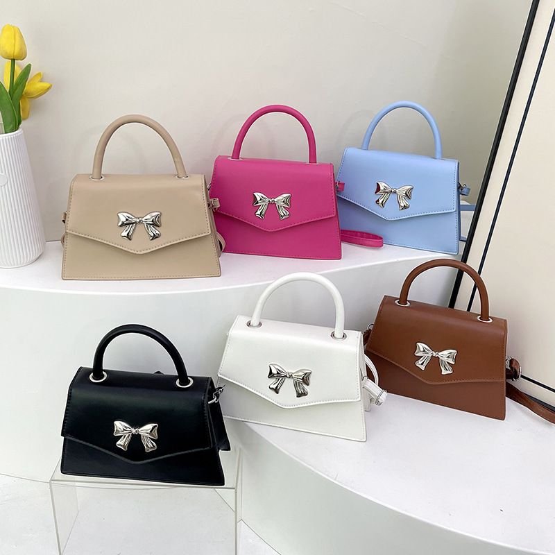 Bow style shoulder handbag