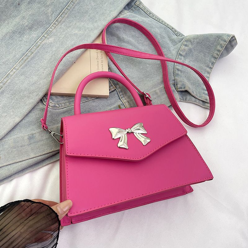 Bow style shoulder handbag