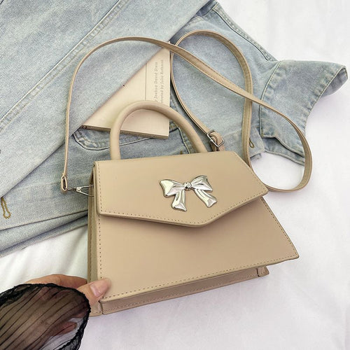 Bow style shoulder handbag